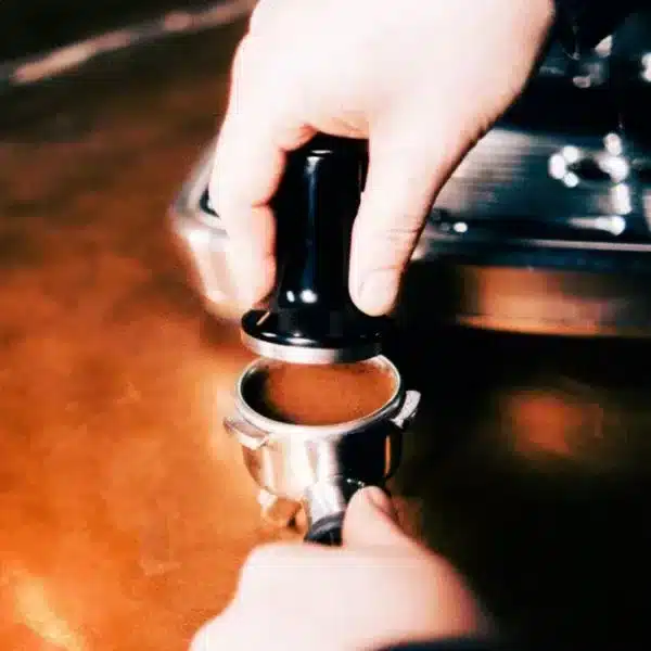 sage barista master class An image of somebody using a sage coffee machine