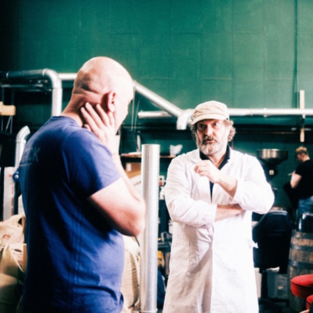 arial view of a flat white coffee on a copper table top