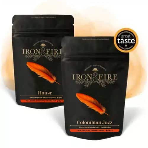 an image of 2 black coffee bags with orange feather on the label